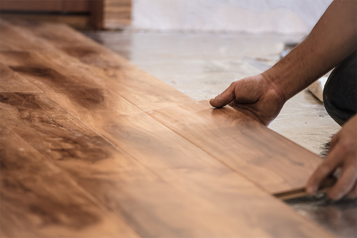 installation of a hardwood floor through a locking process