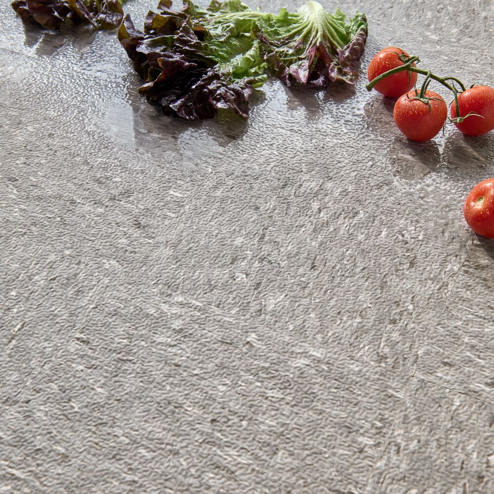 Produce and water on a slip-retardant grocery store floor